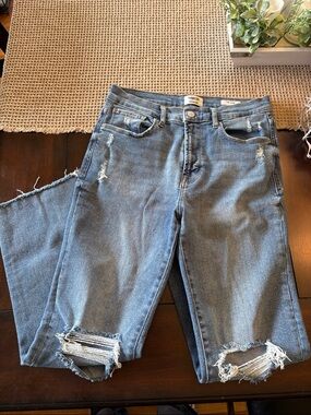 Distressed Women's Blue Denim Jeans